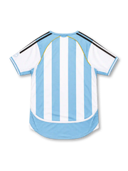 Argentina 2006 adidas home jersey with sky-blue and white vertical stripes, black adidas shoulder stripes, white sleeves, curved sky-blue panels, gold piping, central adidas logo, AFA crest with two gold stars, and CLIMACOOL detailing.