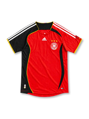 Germany 2006 red away jersey with black panel, gold piping, adidas logo and three-star DFB crest