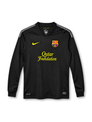 Barcelona 2011/12 black away long sleeve jersey with yellow Nike Swoosh, Qatar Foundation sponsor, club crest and white shoulder detailing.