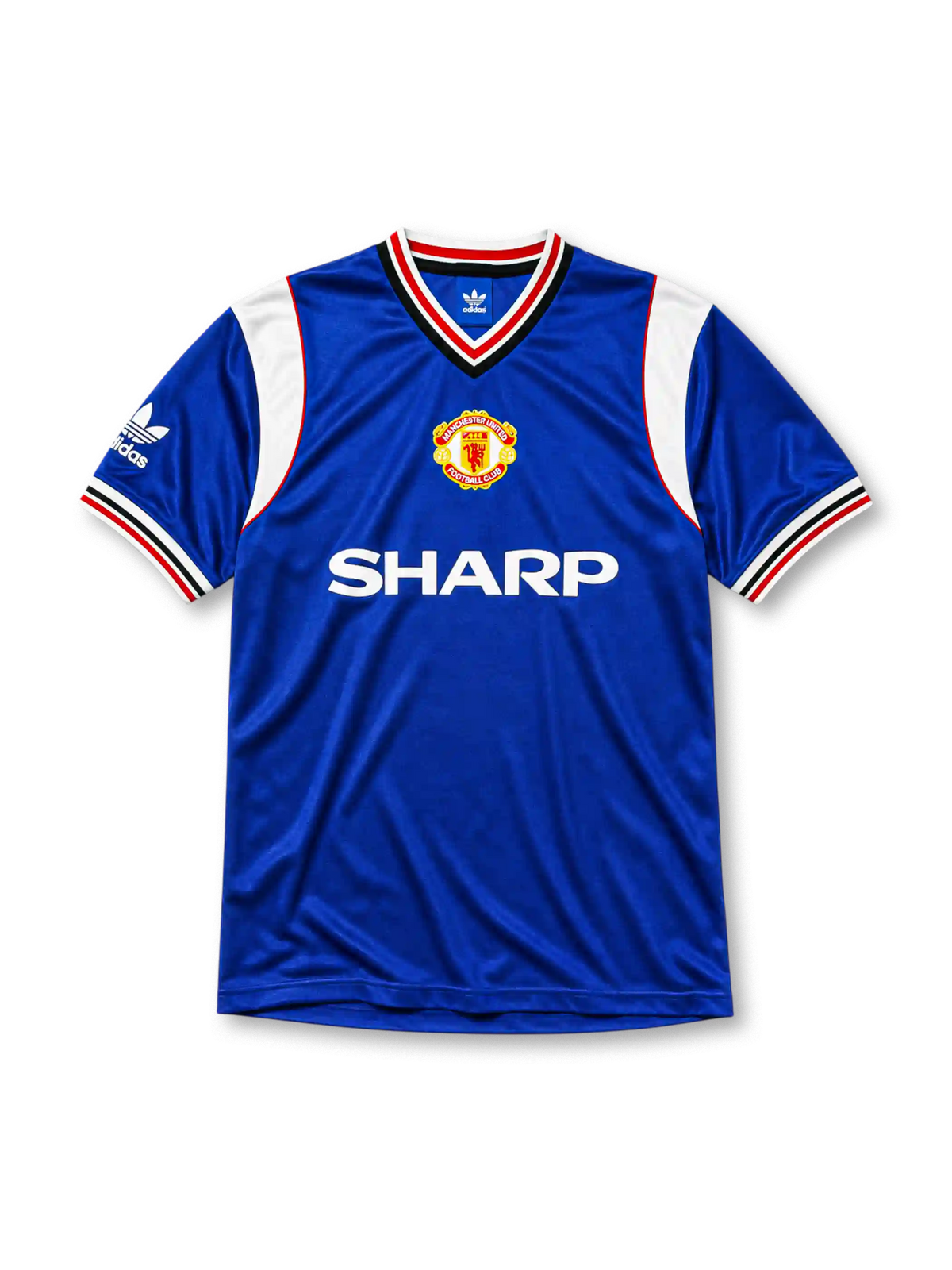 Manchester United 1985-86 third jersey, front view, royal blue body, white striped V-neck collar, white sleeve panels with black and red trim, adidas trefoil logo on sleeve, club crest, SHARP sponsor logo, striped ribbed cuffs