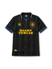Manchester United 1993-94 away jersey, front view, black body with tonal diamond jacquard pattern, gold and blue striped collar, Umbro diamond logo, club crest, SHARP Viewcam sponsor logo, gold and blue diamond cuffs