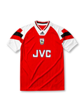Arsenal 1992-93 home jersey, front view, red body, white raglan sleeves with black and red geometric panels, white V-neck collar with black and red trim, adidas Equipment wordmark, club cannon crest, JVC sponsor logo, white ribbed cuffs
