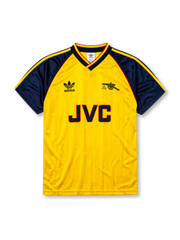 Arsenal 1988-90 away jersey, front view, yellow body with navy raglan sleeves, yellow V-neck collar with navy and red trim, adidas trefoil logo, club cannon crest, JVC sponsor logo, navy sleeve cuffs