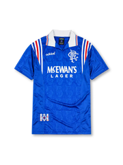 Rangers 1996-97 home jersey, front view, royal blue body with tonal jacquard pattern, white and red shoulder stripes, white collar with red and blue trim, adidas Equipment logo, club crest, McEwan's Lager sponsor logo, commemorative badge