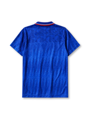 Chelsea 1989-91 home jersey, front view, royal blue body with diagonal jacquard texture, striped point collar, two-button placket, Umbro diamond logo, club lion crest, Commodore sponsor logo