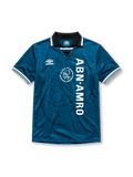 Ajax 1995-96 away jersey, front view, teal body with tonal crest pattern, black point collar with white and teal stripes, Umbro diamond logo, club crest with Amsterdam text, vertical ABN AMRO sponsor lettering, striped cuffs
