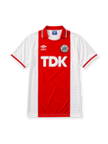 Ajax 1989-90 home jersey, front view, white body with central red stripe, red point collar with white and black trim, Umbro diamond logo, club crest, TDK sponsor logo, striped cuffs