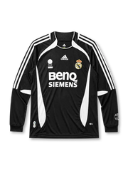 Real Madrid 2006-07 long sleeve third jersey, front view, black body with white side panels, adidas three-stripe long sleeve detailing, FIFA Fair Play emblem, adidas logo, club crest, BenQ Siemens sponsor logo, ribbed cuffs