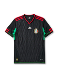 Mexico 2010 World Cup away jersey, front view, black body with tonal diamond pattern, red V-neck collar, red and black striped shoulders, green side panels, adidas logo, Mexican Football Federation crest, green hem trim
