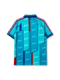 Barcelona 1995-97 away jersey, front view, teal body with angular geometric panels, repeated Barça script pattern, teal point collar, Kappa Omini sleeve pattern, Kappa wordmark, club crest, striped cuffs