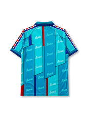 Barcelona 1995-97 away jersey, front view, teal body with angular geometric panels, repeated Barça script pattern, teal point collar, Kappa Omini sleeve pattern, Kappa wordmark, club crest, striped cuffs