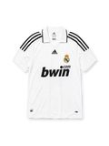 Real Madrid 2008-09 home jersey, front view, white body, black adidas three-stripe shoulder detailing, point collar, adidas logo, club crest, bwin.com sponsor logo, Climacool badge