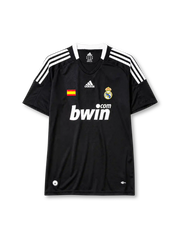 Real Madrid 2008-09 away jersey, front view, black body, white adidas three-stripe shoulder detailing, crew neck collar, Spanish flag patch, adidas logo, club crest, bwin.com sponsor logo, Climacool badge
