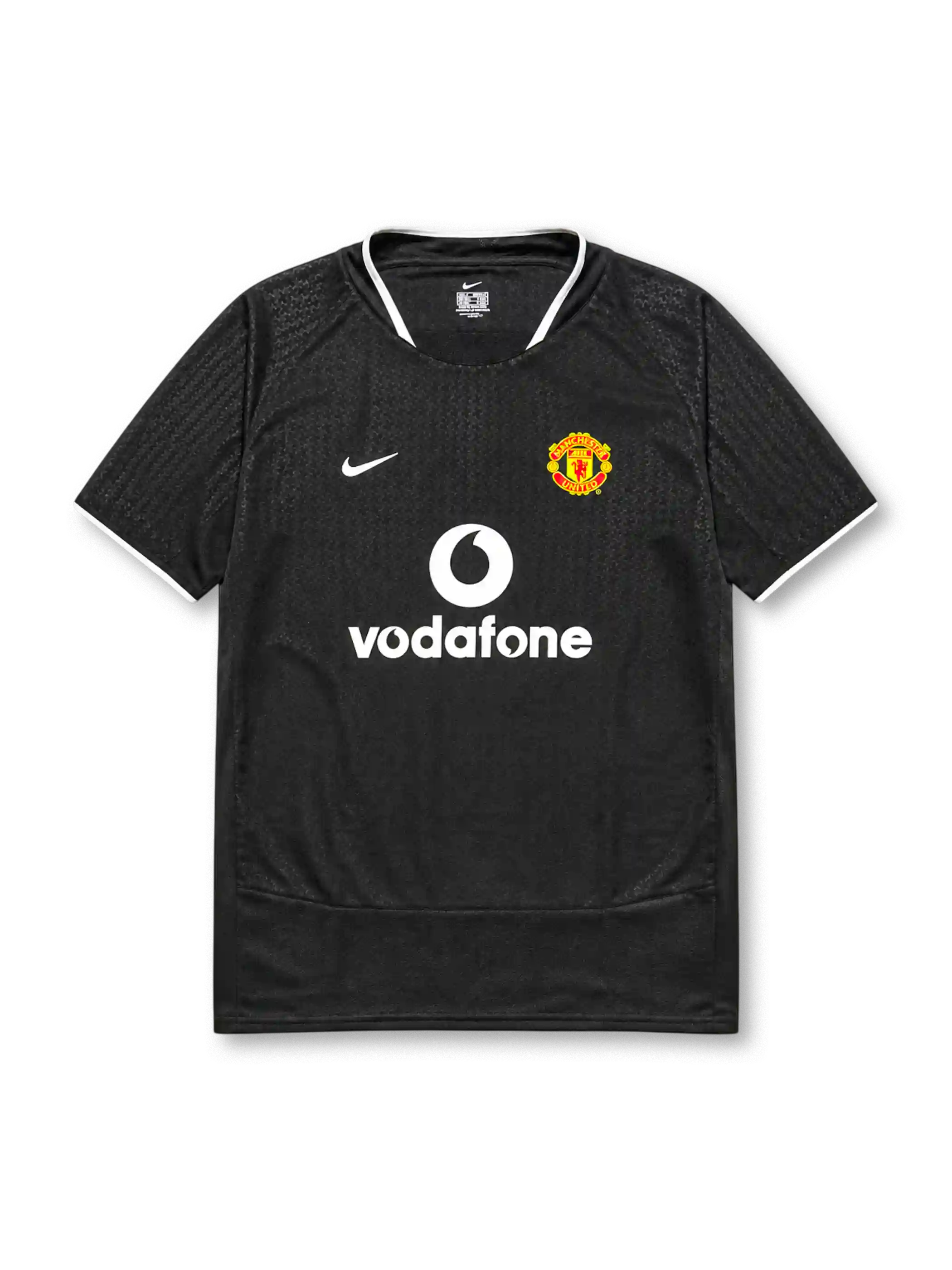 Manchester United 2003-04 away jersey, front view, black body with tonal geometric pattern, white ringer collar and cuffs, Nike swoosh logo, club crest, Vodafone sponsor logo