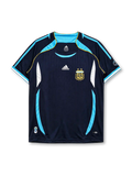 Argentina 2006 World Cup away jersey, front view, navy body with pinstripes, sky blue curved side panels, sky blue V-neck collar, adidas logo, AFA crest with two stars, World Cup sleeve emblem