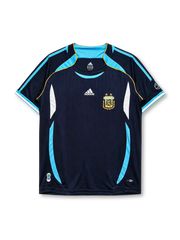 Argentina 2006 World Cup away jersey, front view, navy body with pinstripes, sky blue curved side panels, sky blue V-neck collar, adidas logo, AFA crest with two stars, World Cup sleeve emblem