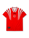 Turkey 1996 Euro home jersey, front view, red body with white angular shoulder streaks, striped V-neck collar, adidas wordmark, Turkish Football Federation crest