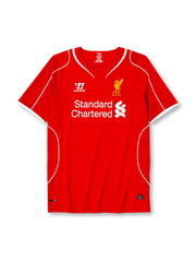Liverpool 2014-15 home jersey, front view, red body with white piping, V-neck collar, Warrior logo, simplified Liver Bird L.F.C. crest, Standard Chartered sponsor logo