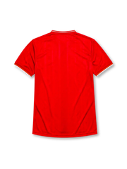 Liverpool 1985-86 home jersey, front view, red body, white V-neck collar with red and yellow stripe trim, white cuffs with yellow stripe, white L.F.C. liver bird crest, white Crown Paints sponsor logo, circular 1985-1986 double winners badge on left chest