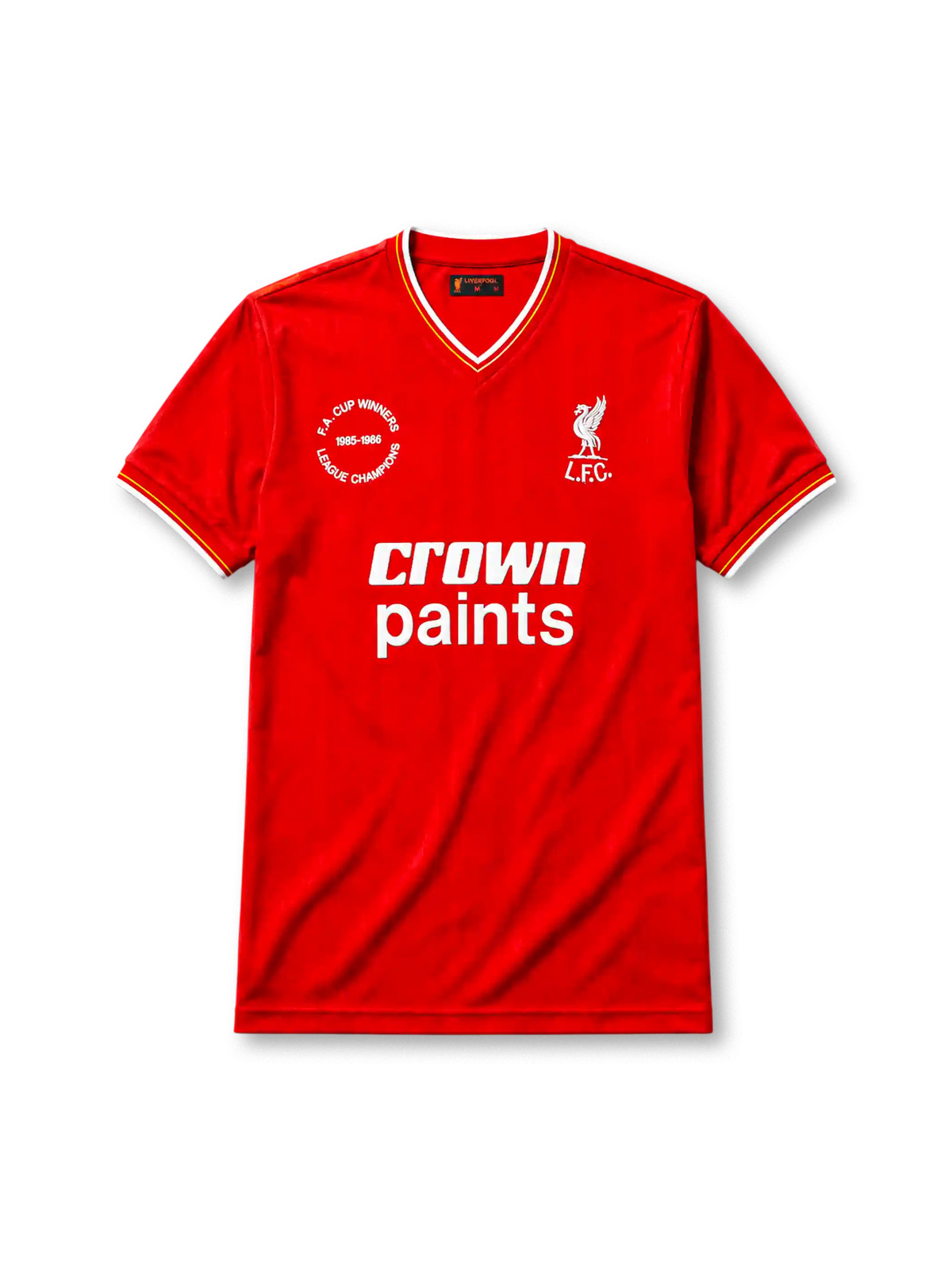 Liverpool 1985-86 home jersey, front view, red body, white V-neck collar with red and yellow stripe trim, white cuffs with yellow stripe, white L.F.C. liver bird crest, white Crown Paints sponsor logo, circular 1985-1986 double winners badge on left chest