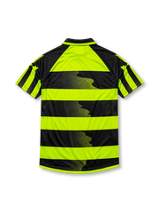 Celtic 1996-97 away jersey, front view, neon-yellow and black hooped design, black polo-style collar, diagonal striped raglan sleeves, white Umbro logo, Celtic shield crest with shamrock, white CR Smith sponsor logo, Celtic F.C. text near hem