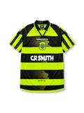 Celtic 1996-97 away jersey, front view, neon-yellow and black hooped design, black polo-style collar, diagonal striped raglan sleeves, white Umbro logo, Celtic shield crest with shamrock, white CR Smith sponsor logo, Celtic F.C. text near hem