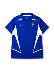 Brazil 2002 away jersey, front view, blue body with white angular side panels, point collar, Nike swoosh logo, CBF crest with four stars, Brasil text