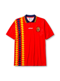 Spain 1994-95 home jersey, front view, red body with yellow and navy diamond pattern, navy point collar with yellow and red stripes, adidas wordmark, Royal Spanish Football Federation crest