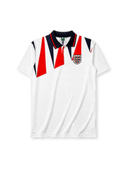 England 1992 home jersey, front view, white body with red and navy jagged triangle pattern, navy polo-style collar with red stripe trim, Three Lions crest with roses, small red logo mark near right shoulder
