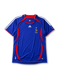 France 2006 home jersey, front view, royal blue body with red crew-neck collar and piping, curved red side panels, white adidas logo and stripes, gold F.F.F. rooster crest with star, small 2006 World Cup emblem near hem, ClimaCool tag