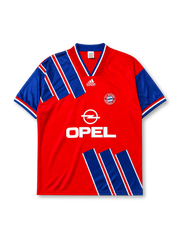 Bayern Munich 1993-95 home jersey, front view, red body with diagonal blue and white stripe panels, blue V-neck collar with white piping, white adidas Equipment logo, FC Bayern Munchen crest, white Opel sponsor logo, striped cuffs