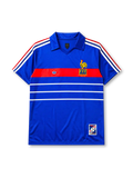 France 1984 home jersey, front view, royal blue body with tricolor striped shoulders, red horizontal chest band with white adidas trefoil logo, gold F.F.F. rooster crest with European Champions 1984 text, double white stripes, commemorative patch near hem