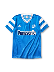 Marseille 1990 away jersey, front view, sky blue body with tonal pinstripe pattern, white V-neck collar with red and blue piping, white adidas trefoil logo, circular Olympique de Marseille crest, navy Panasonic sponsor logo