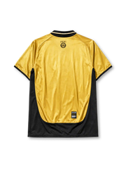 Manchester United 2001-02 away jersey, front view, gold body with black side panels, black V-neck collar with white piping, black Umbro logo, Manchester United devil crest and centenary 100 badge, black Vodafone sponsor logo