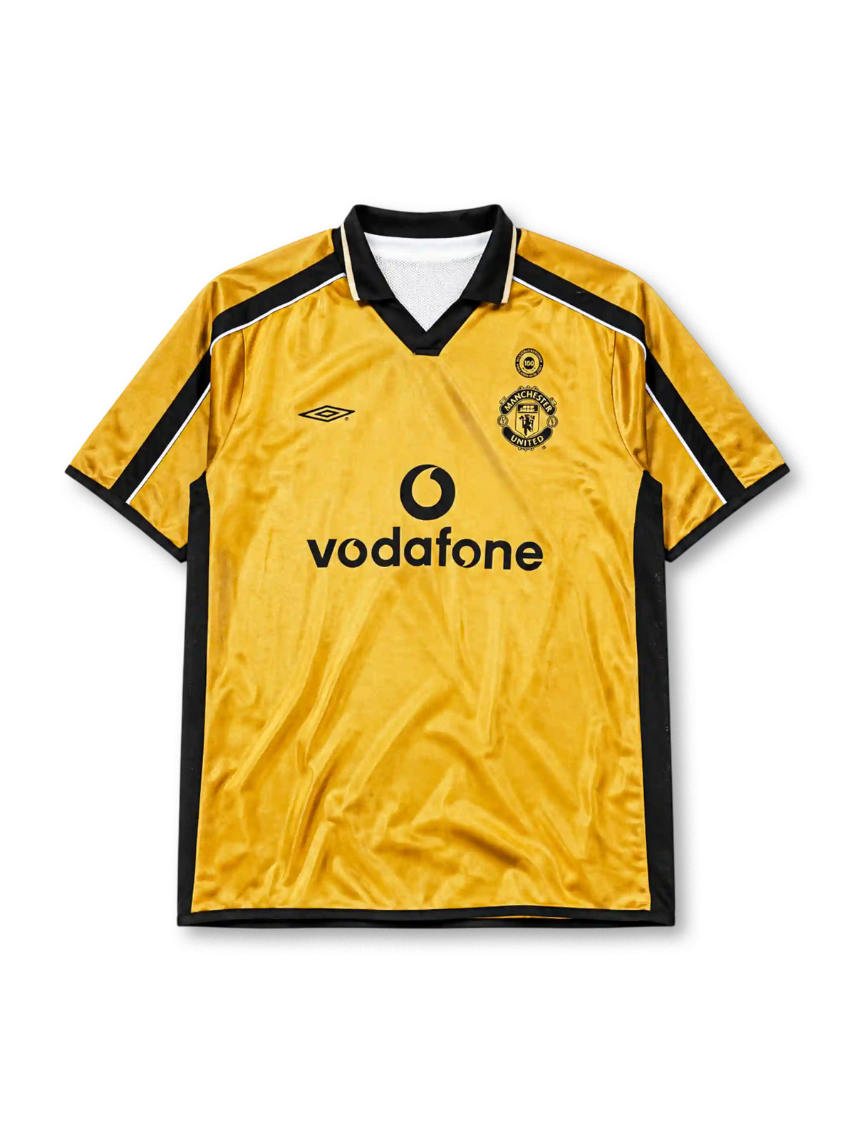 Manchester United 2001-02 away jersey, front view, gold body with black side panels, black V-neck collar with white piping, black Umbro logo, Manchester United devil crest and centenary 100 badge, black Vodafone sponsor logo