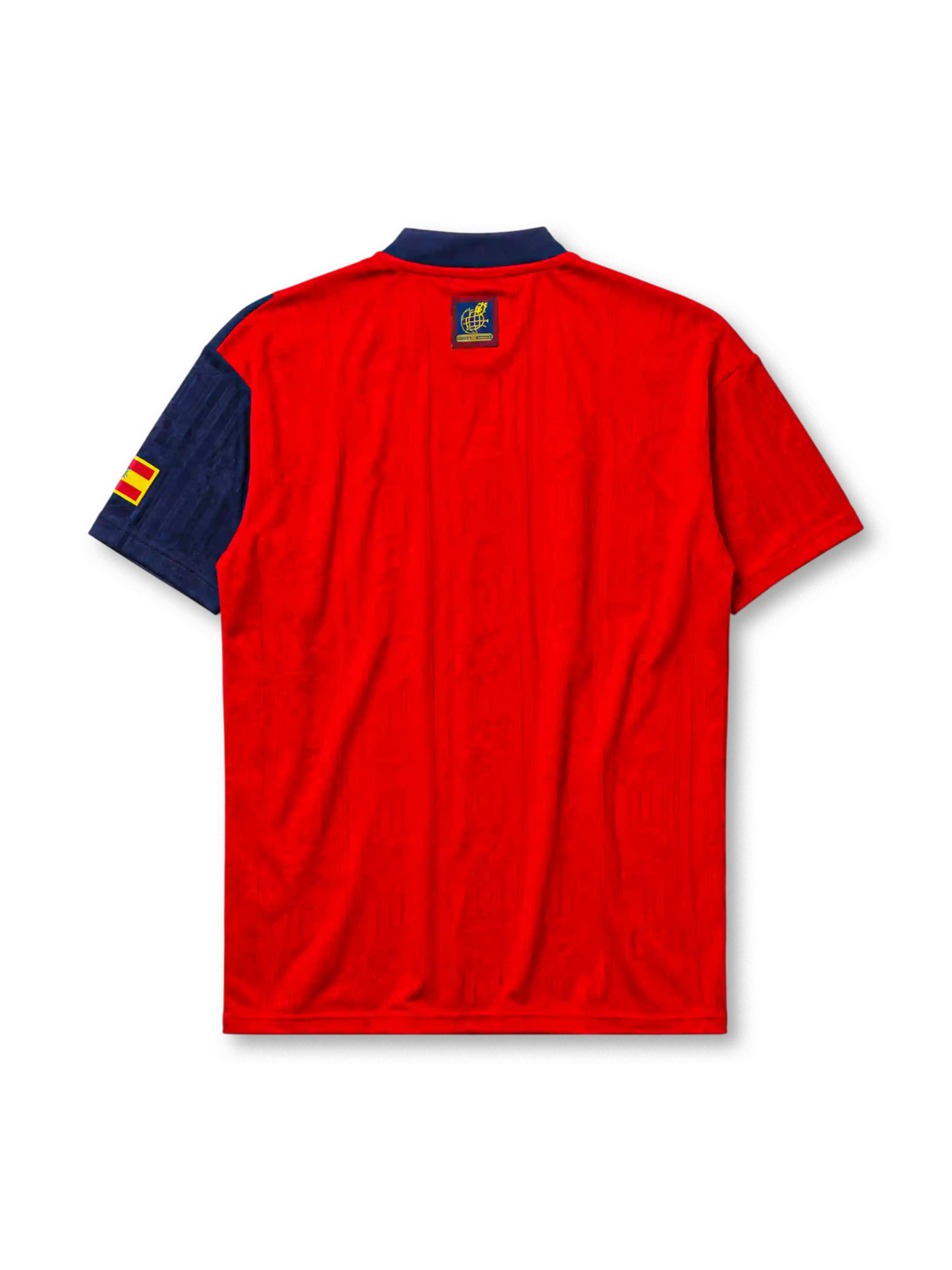 Spain 1996 home jersey, front view, red body with asymmetric navy side panel, navy button-placket collar, yellow adidas logo and stripes, Spanish royal crest, small Spain flag patch on sleeve, Federacion Espanola de Futbol tag near hem