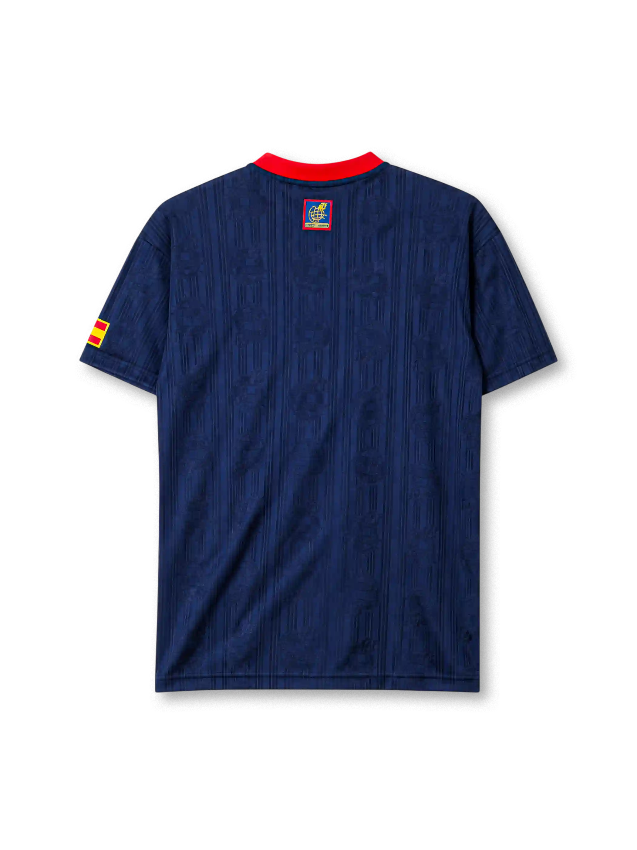 Spain 1996 away jersey, front view, navy body with tonal jacquard pattern, red button-placket collar, yellow adidas logo, bold red and yellow vertical stripe, Spanish royal crest, small Spain flag patch on sleeve