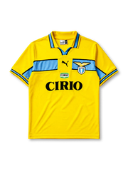 Lazio 1998-99 away jersey, front view, bright yellow body with sky blue chest band, yellow polo-style collar with black and blue trim, black Puma logo, S.S. Lazio eagle crest, Cirio sponsor logo and badge, sky blue cuffs