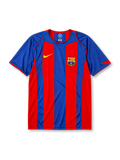 Barcelona 2004-05 home jersey, front view, bold blue and garnet vertical stripes, blue crew-neck collar with red trim, yellow Nike swoosh, Barcelona crest, no shirt sponsor