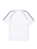 Real Madrid 1986-87 home jersey, front view, white body with navy Hummel chevron sleeve pattern, polo-style collar with navy piping, navy Hummel logo, Real Madrid crest with crown, navy Parmalat sponsor logo