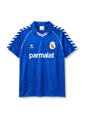 Real Madrid 1986-87 away jersey in blue with Parmalat sponsor and Hummel chevron pattern
