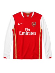 Arsenal 2006-07 long-sleeve home jersey, front view, red body with white sleeves, gold pinstripes, Nike swoosh, Fly Emirates sponsor logo, club crest, Emirates Stadium collar tag