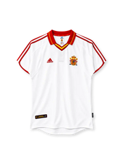Spain 2000 away jersey, front view, white body, red fold-over collar with yellow stripe, red and yellow V-neck insert, red three stripes on shoulders and sleeves, red sleeve cuff trim, red adidas logo on right chest, Spanish coat of arms crest on left chest, black authentic licensed product badge at lower left hem, curved hem