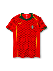 Portugal 2004 home jersey, front view, red body with tonal dark red cross-motif pattern, green crew neck and collar yoke, yellow piping down the front, yellow Nike swoosh on right chest, Portuguese Football Federation crest on left chest, green sleeve cuffs