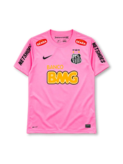 Santos 2013 pink jersey, front view, pink body, pink crew neck collar, red SEARA logos near shoulders, black NETSHOES lettering on sleeves, black Nike swoosh on right chest, Santos crest with two gold stars and 1912-2012 centenary crown on left chest, BANCO BMG sponsor logo, Nike Authentic tag at hem