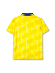 Colombia 1995 home jersey, front view, bright yellow body with white diamond jacquard and deeper yellow football-panel print, royal blue polo collar with yellow tipping, blue UMBRO wordmark on right chest, Colombian Football Federation crest on left chest