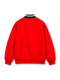 Manchester United 2026/27 red and black adidas Stadium track jacket featuring bold geometric checkerboard graphics, a white adidas logo, full-colour club crest, stand-up collar, and full-length front zipper.