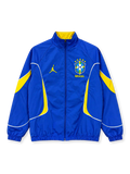 Front view of the Brazil 2026 Jordan anthem track jacket in royal blue with yellow curved sleeve and side panels, white piping, yellow Jumpman logo, five-star CBF crest, full zipper, and stand-up collar with yellow lining.