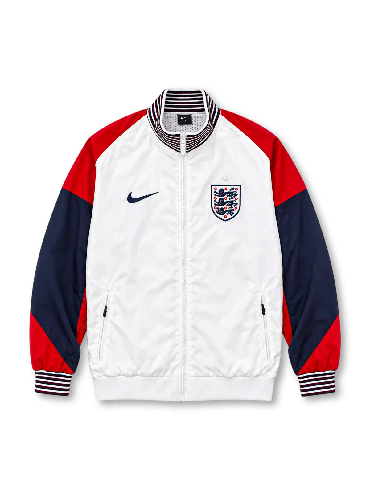 Front view of the England 2024/25 Nike Strike Anthem Jacket featuring a white body, red shoulders, navy sleeves, striped stand collar and cuffs, dark Nike Swoosh, Three Lions crest, full zipper, and zippered pockets.