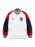 Front view of the England 2024/25 Nike Strike Anthem Jacket featuring a white body, red shoulders, navy sleeves, striped stand collar and cuffs, dark Nike Swoosh, Three Lions crest, full zipper, and zippered pockets.